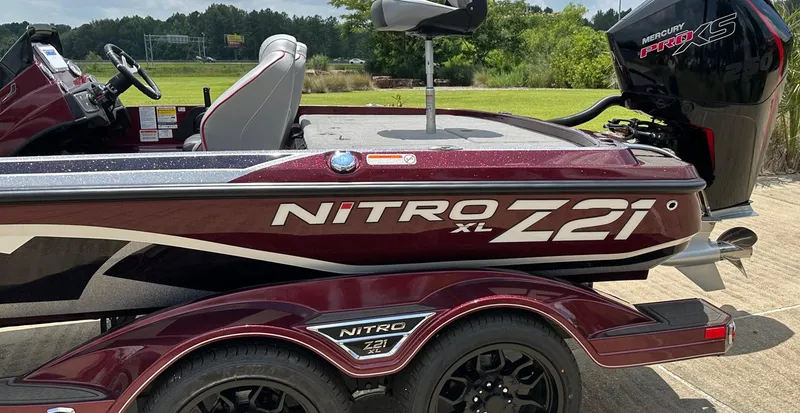 Slide: The Image of 2023 Nitro Z21 XL boat with Mercury Pro XS engine on trailer. - 2