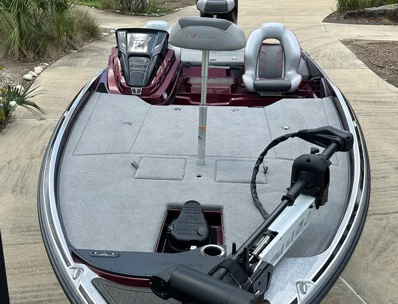 Slide: The Image of 2023 Nitro Z21 XL bass boat with trolling motor and spacious deck. - 3
