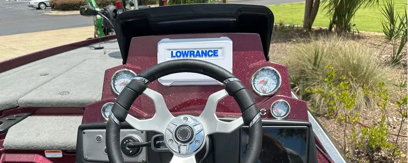 Slide: The Image of 2023 Nitro Z21 XL boat dashboard with Lowrance electronics and steering wheel. - 4