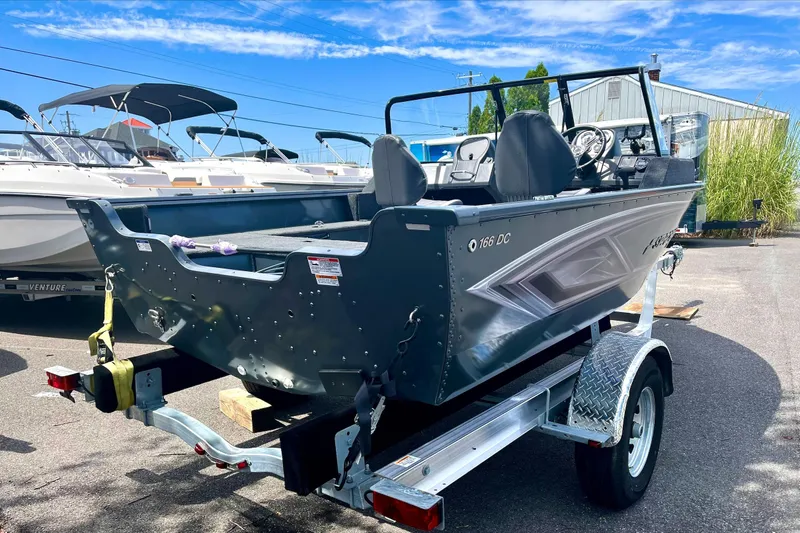 Slide: The Image of 2023 Starcraft Storm 166 DC boat on trailer in marina. - 3