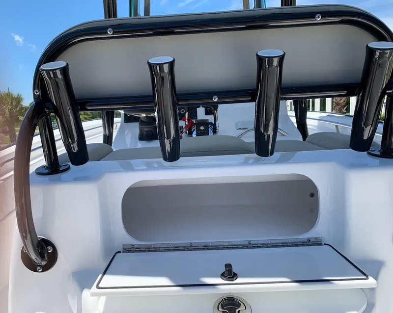 Slide: The Image of 2024 Cape Horn 24 XS boat with rod holders and storage compartment. - 12