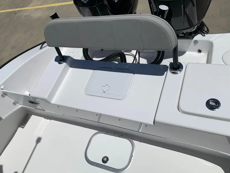 Slide: The Image of 2024 Cape Horn 24 XS boat rear seating and storage area. - 15