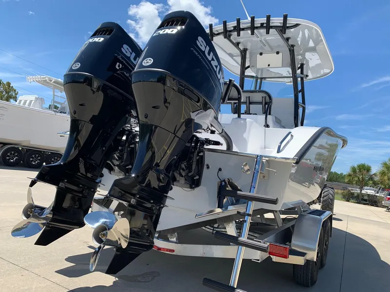 Slide: The Image of 2024 Cape Horn 24 XS boat with twin Suzuki outboard engines on trailer. - 3