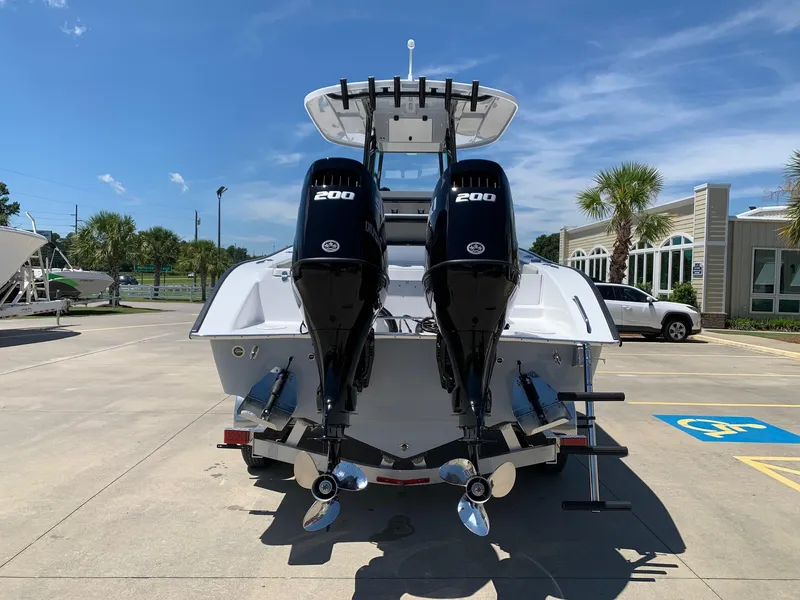 Slide: The Image of 2024 Cape Horn 24 XS boat with twin 200 HP engines, rear view. - 4