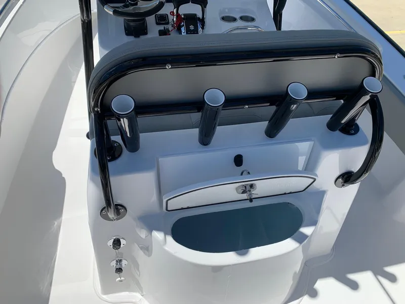 Slide: The Image of 2024 Cape Horn 24 XS boat console with rod holders and storage compartment. - 12