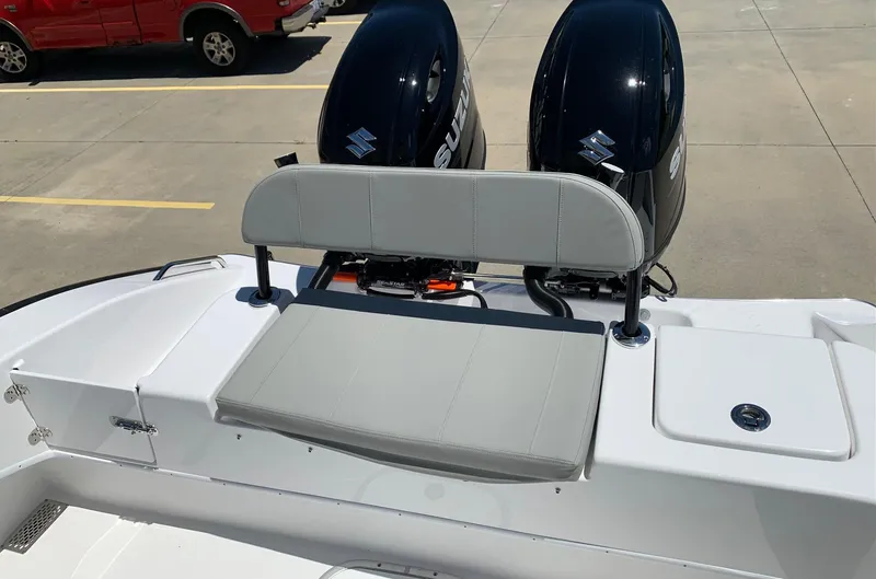 Slide: The Image of 2024 Cape Horn 24 XS boat with dual Suzuki outboard engines and rear seating. - 13