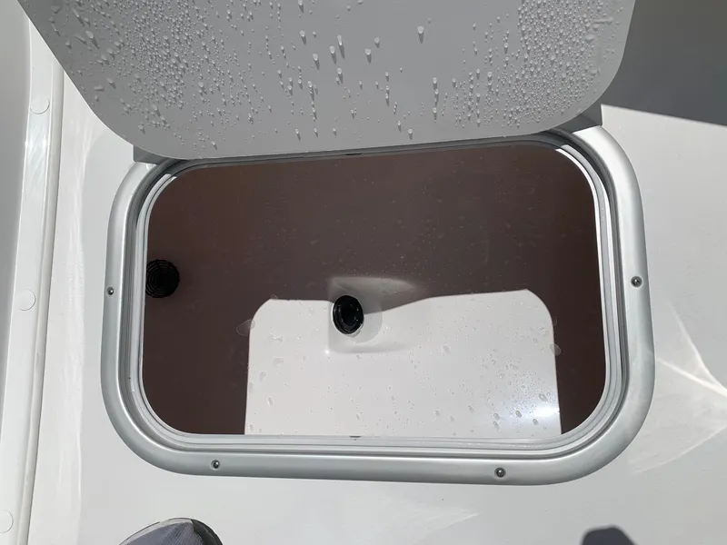 Slide: The Image of Open storage compartment on a 2024 Cape Horn 24 XS boat. - 22
