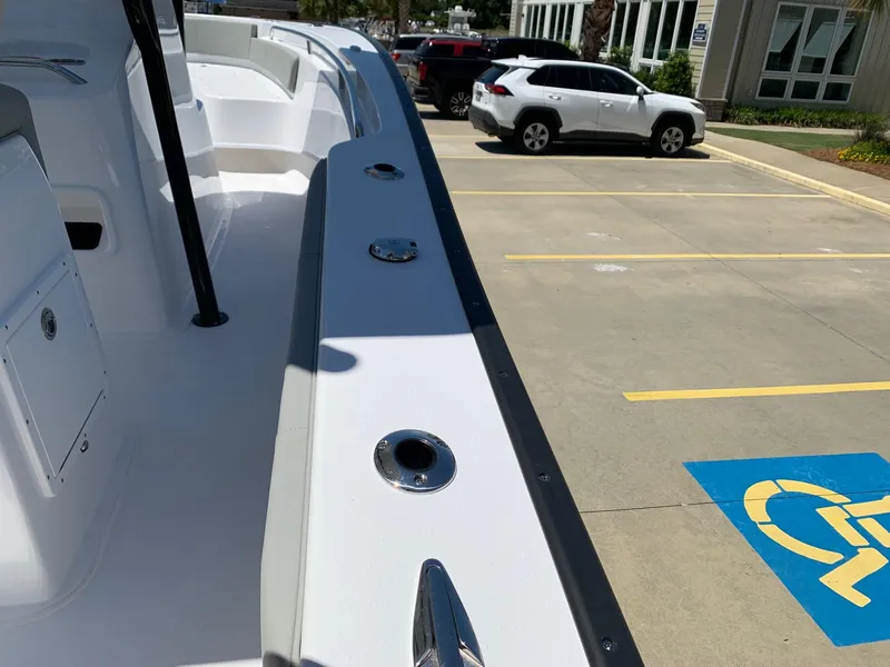 Slide: The Image of 2024 Cape Horn 24 XS boat in parking lot, side view. - 24