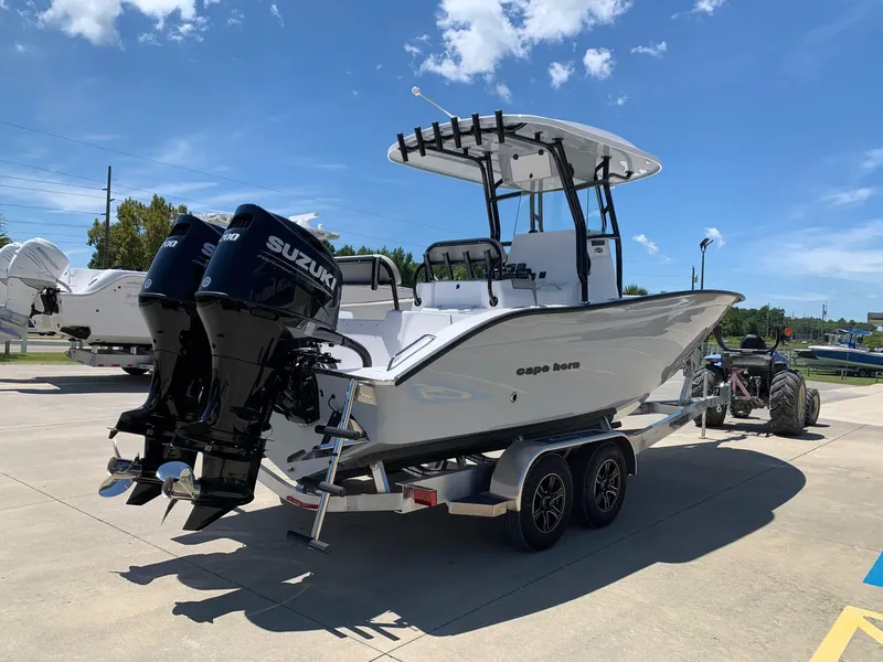 Slide: The Image of 2024 Cape Horn 24 XS boat with dual Suzuki engines on a trailer. - 3