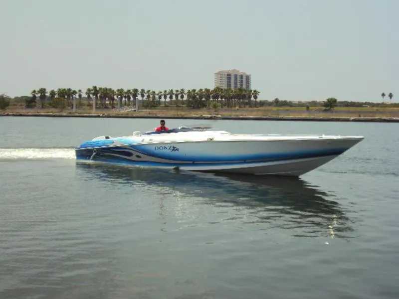 Slide: The Image of 2006 Donzi 43 ZR speedboat cruising on calm water. - 0