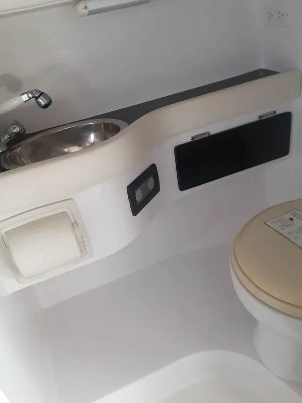 Slide: The Image of 2006 Donzi 43 ZR boat bathroom with sink and toilet. - 12