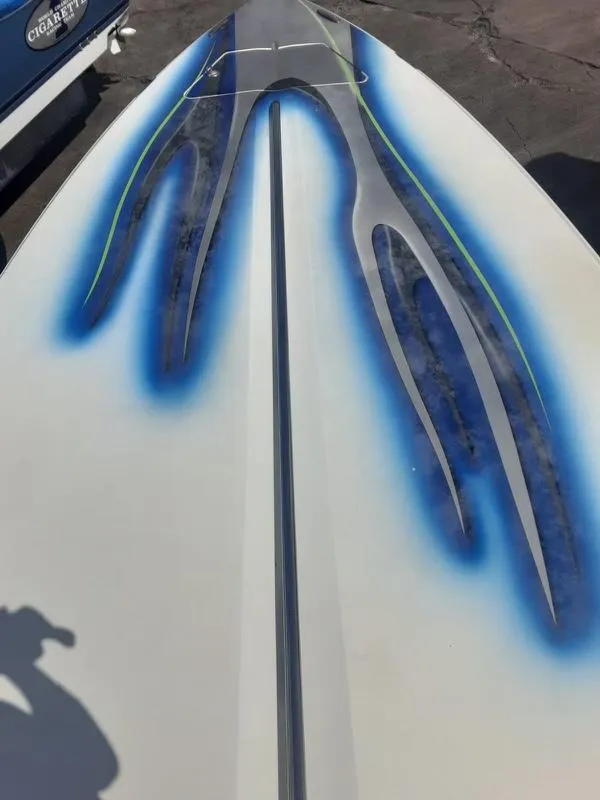 Slide: The Image of 2006 Donzi 43 ZR boat with custom blue and black graphics. - 13
