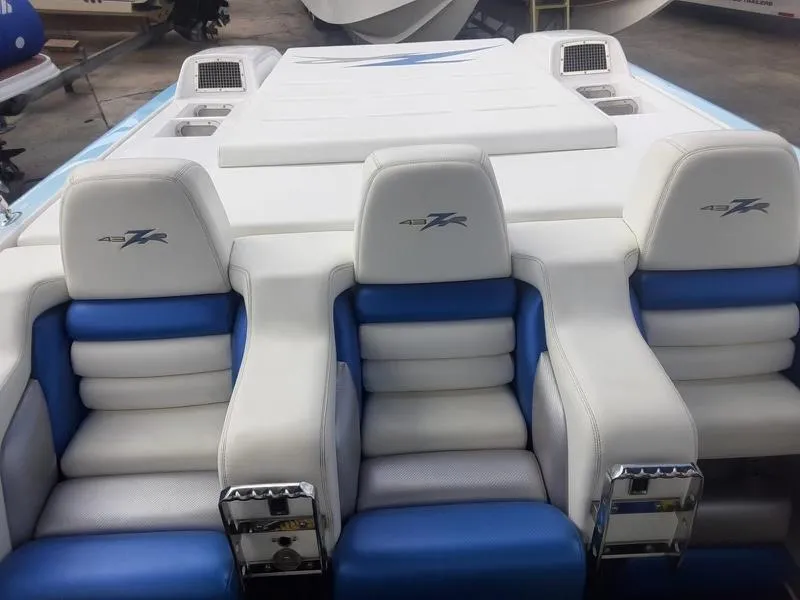 Slide: The Image of 2006 Donzi 43 ZR boat interior with white and blue seating. - 15