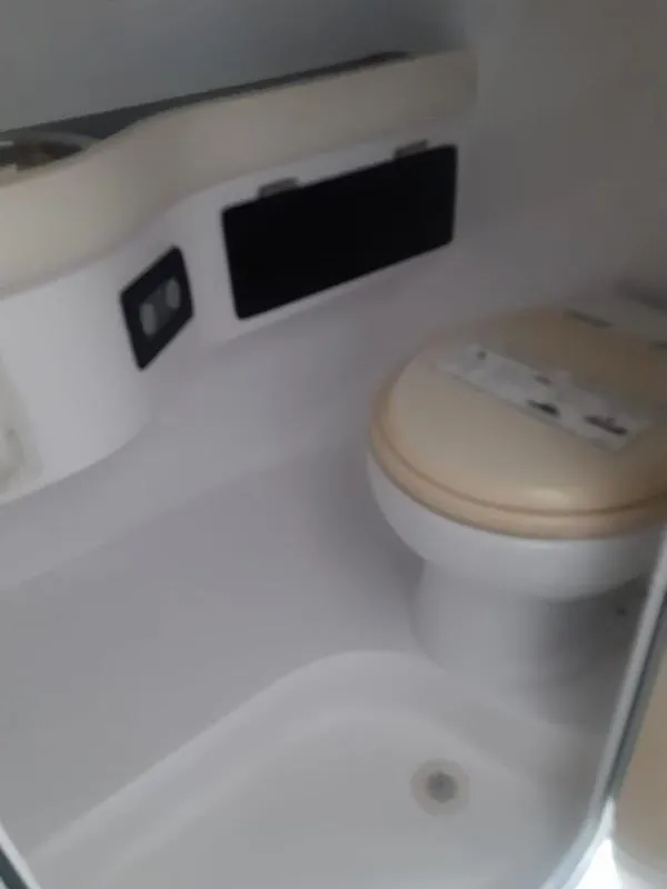 Slide: The Image of 2006 Donzi 43 ZR boat bathroom interior with toilet and sink. - 16