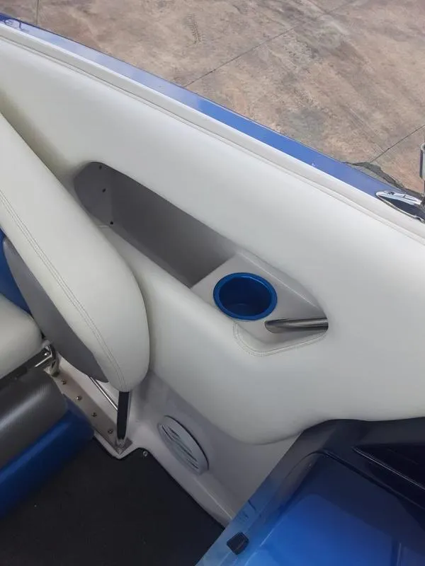 Slide: The Image of Interior detail of a 2006 Donzi 43 ZR boat with white upholstery and blue accents. - 21