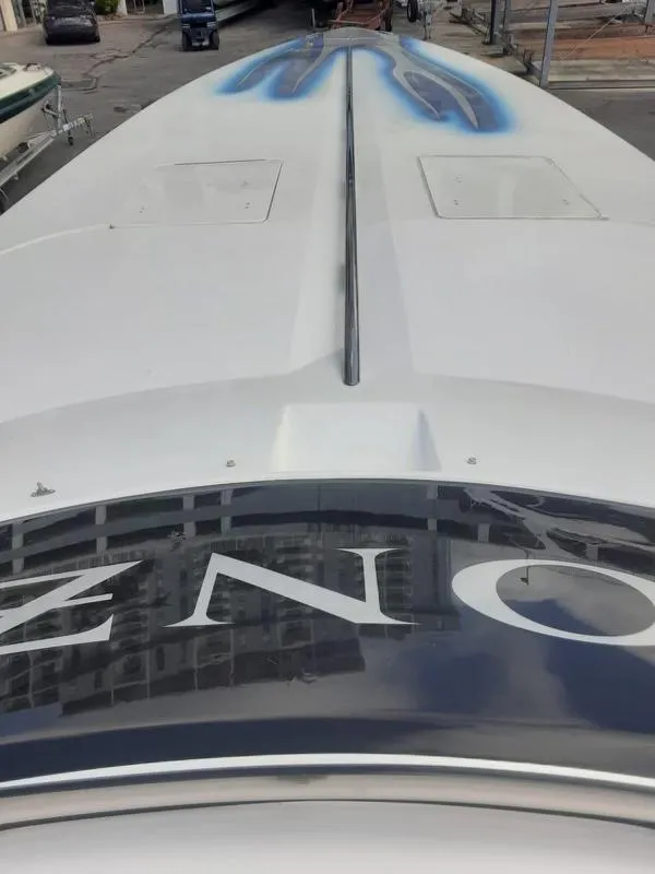 Slide: The Image of 2006 Donzi 43 ZR boat bow view with blue graphics. - 23
