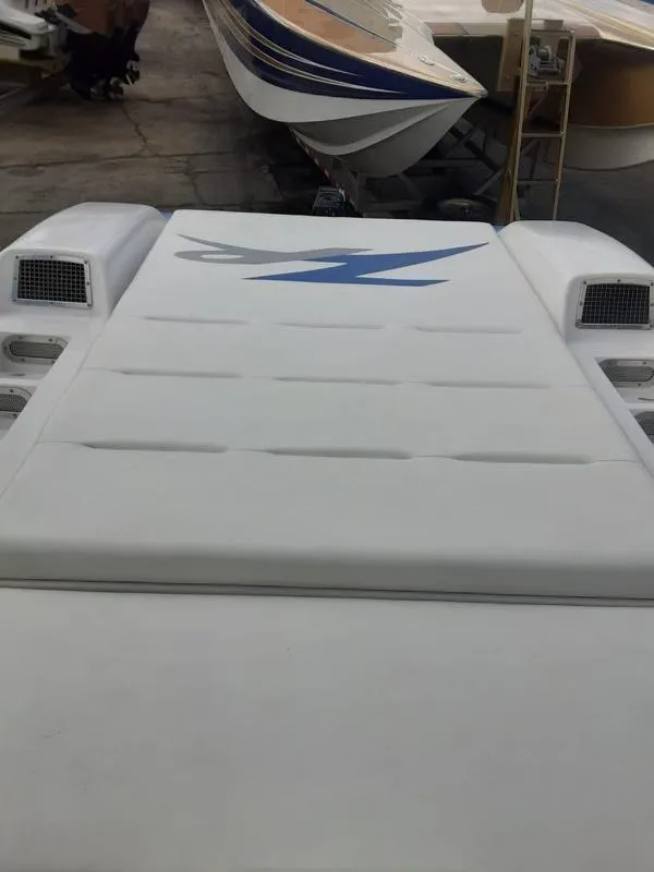 Slide: The Image of 2006 Donzi 43 ZR powerboat rear view with sleek design and logo. - 24