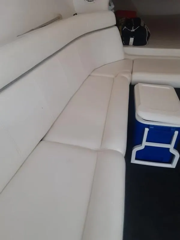 Slide: The Image of Interior seating of a 2006 Donzi 43 ZR boat with white upholstery. - 25