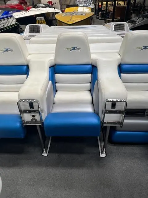 Slide: The Image of 2006 Donzi 43 ZR boat interior with white and blue seating. - 5