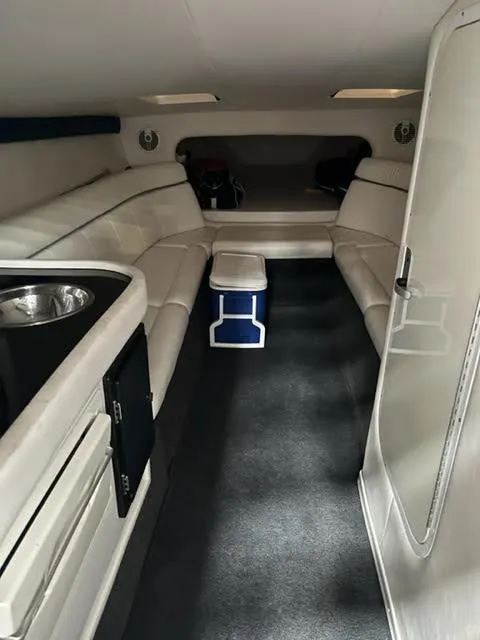 Slide: The Image of Interior cabin of a 2006 Donzi 43 ZR boat with white seating and modern amenities. - 6