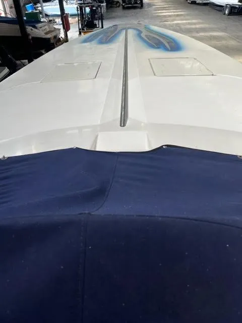 Slide: The Image of 2006 Donzi 43 ZR speedboat with custom blue flame design on deck. - 7