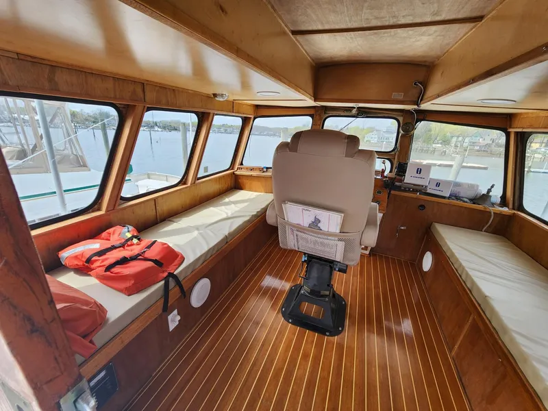 Slide: The Image of Interior of 1980 Tuna Rose Brothers boat with wooden flooring and seating. - 10