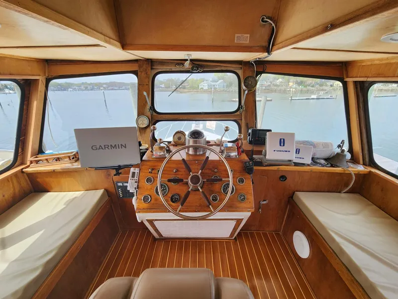 Slide: The Image of 1980 Tuna Rose Brothers boat cockpit with wooden interior and navigation equipment. - 12