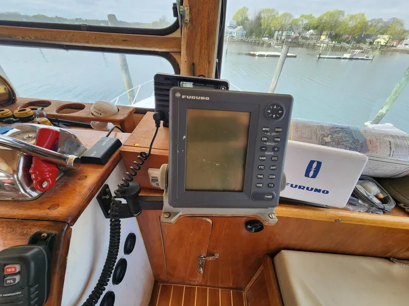 Slide: The Image of 1980 Tuna Rose Brothers boat cockpit with Furuno navigation system. - 13