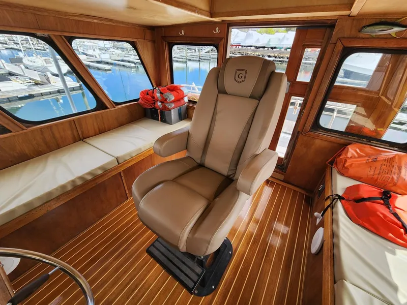 Slide: The Image of Luxurious interior of 1980 Tuna Rose Brothers boat with captain's chair and wooden flooring. - 15