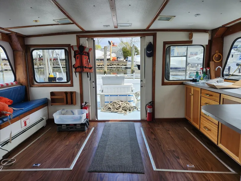 Slide: The Image of Interior of 1980 Tuna Rose Brothers boat with wood flooring and nautical decor. - 22