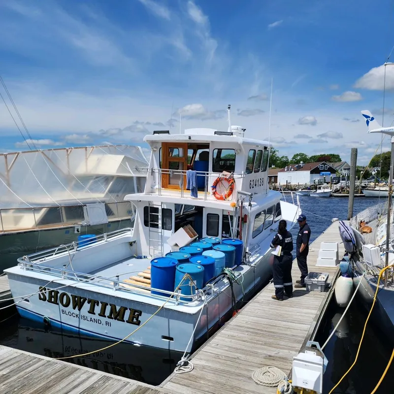 Slide: The Image of Fishing boat "Showtime" docked at marina, Block Island, RI, with blue barrels on deck. - 42
