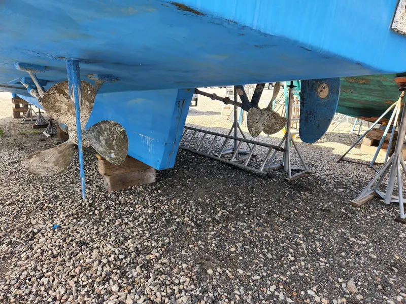 Slide: The Image of 1980 Tuna Rose Brothers boat hull and propellers on gravel. - 9