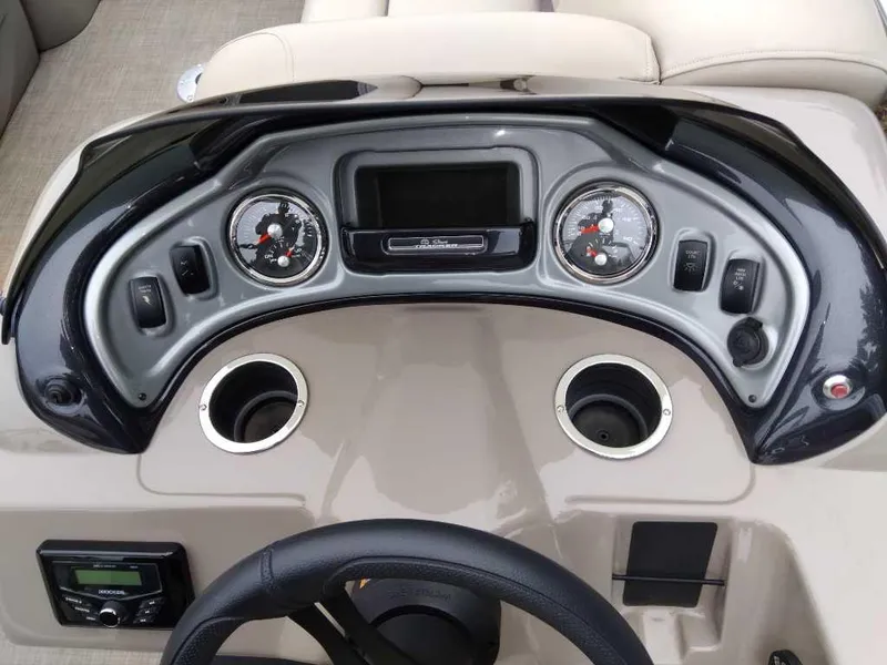 Slide: The Image of Dashboard of 2023 Sun Tracker Party Barge 22 RF DLX with gauges and controls. - 2