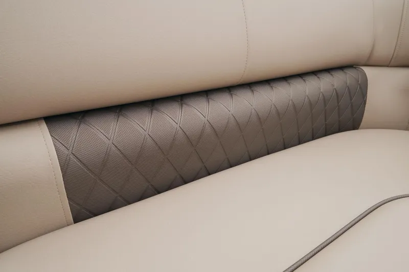 Slide: The Image of Close-up of 2023 Sun Tracker Party Barge 22 RF DLX beige and brown quilted seat. - 29