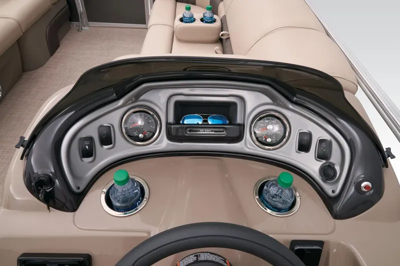 Slide: The Image of 2023 Sun Tracker Party Barge 22 RF DLX dashboard with gauges and cup holders. - 36