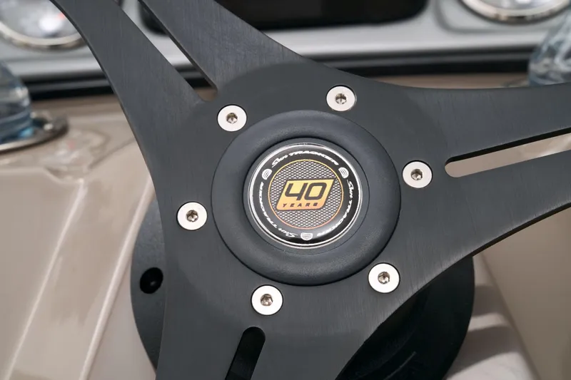 Slide: The Image of Close-up of the steering wheel on a 2023 Sun Tracker Party Barge 22 RF DLX. - 37