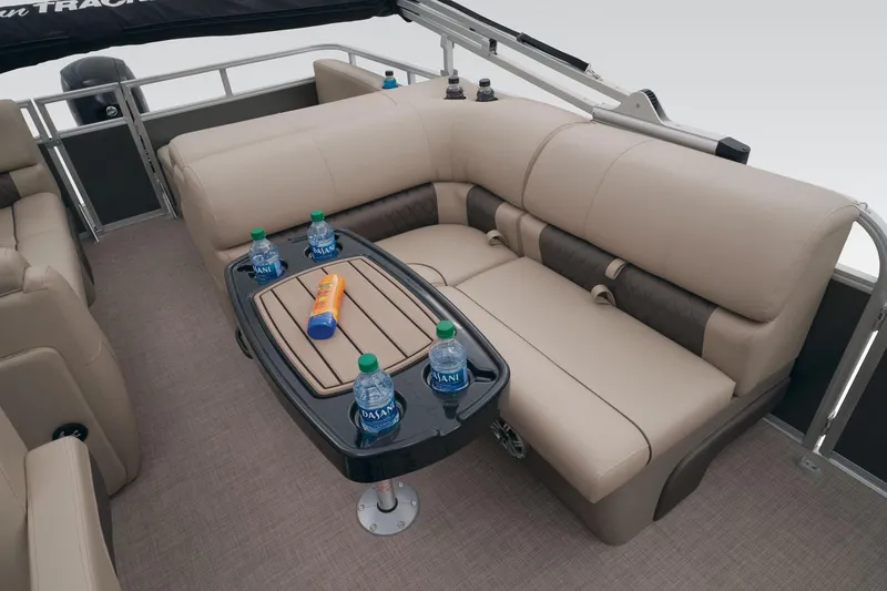 Slide: The Image of 2023 Sun Tracker Party Barge 22 RF DLX interior with beige seating and table. - 39