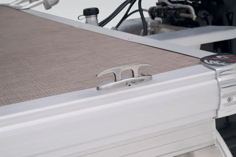 Slide: The Image of Close-up of 2023 Sun Tracker Party Barge 22 RF DLX deck and cleat. - 53