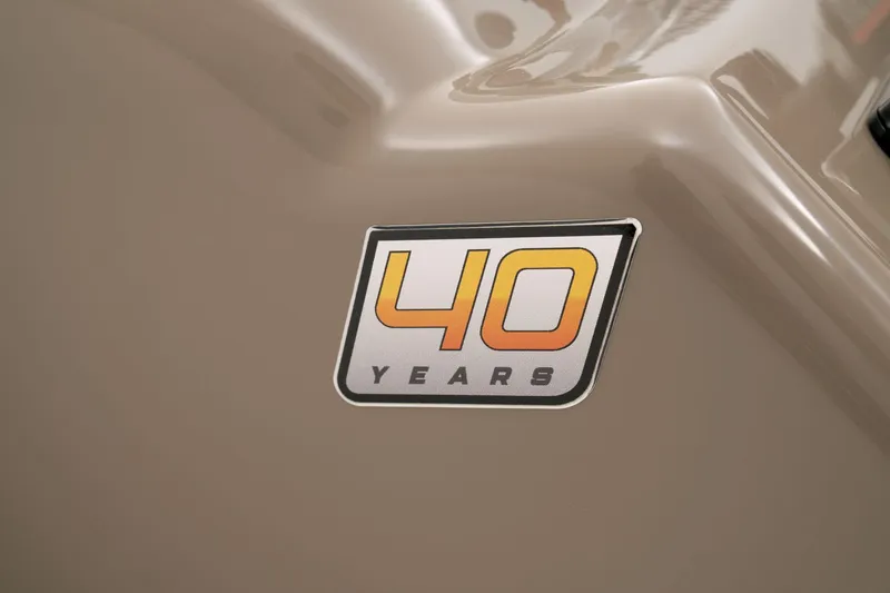 Slide: The Image of 40 Years emblem on 2023 Sun Tracker Party Barge 22 RF DLX. - 54