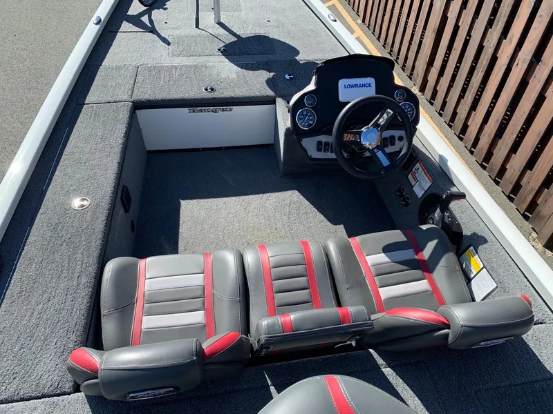 Slide: The Image of 2021 Ranger RT188C boat interior with steering console and seating. - 2