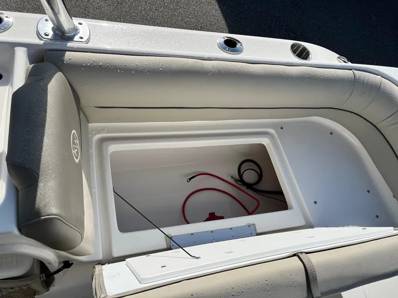Slide: The Image of 2024 Key West 239 DFS boat storage compartment with cushioned seating. - 10