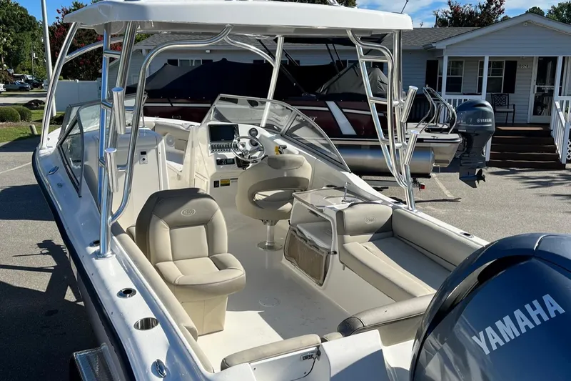 Slide: The Image of 2024 Key West 239 DFS boat with Yamaha engine, featuring spacious seating and modern controls. - 15