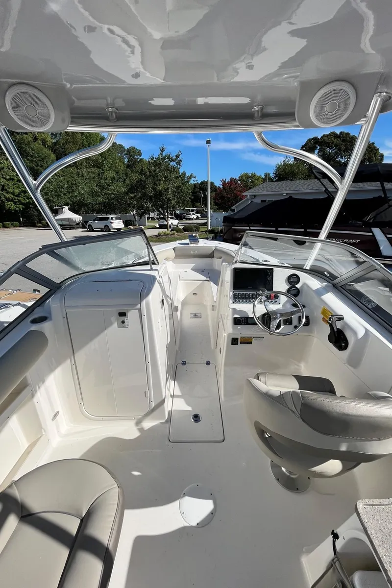 Slide: The Image of 2024 Key West 239 DFS boat interior with helm and seating. - 16