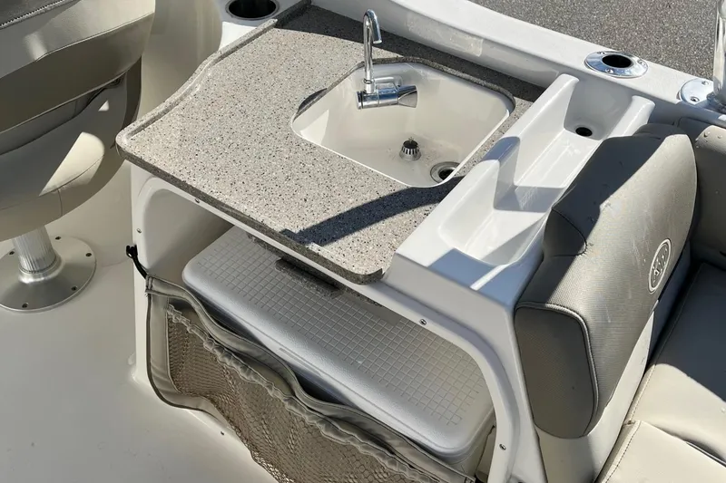 Slide: The Image of 2024 Key West 239 DFS boat interior with sink and storage area. - 17