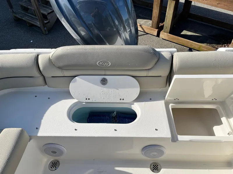 Slide: The Image of 2024 Key West 239 DFS boat interior with storage compartments and seating. - 14