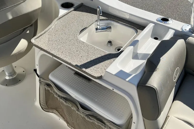 Slide: The Image of 2024 Key West 239 DFS boat interior with sink and storage area. - 18