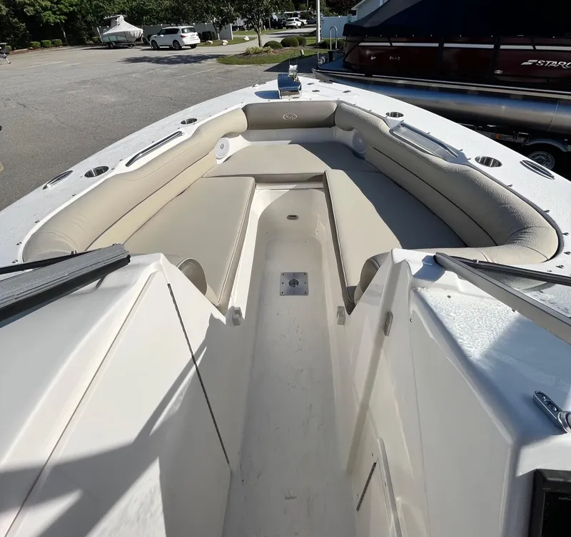 Slide: The Image of 2024 Key West 239 DFS boat interior with beige seating and spacious layout. - 8