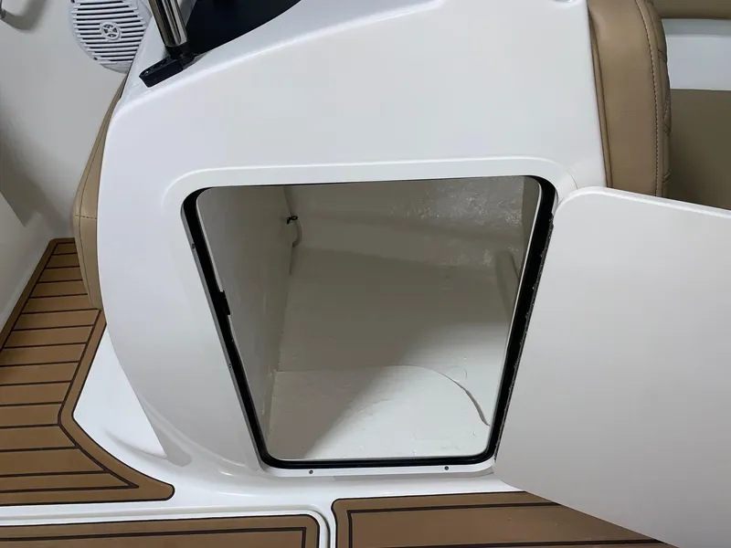 Slide: The Image of 2024 Bayliner VR5 boat storage compartment with open door. - 10