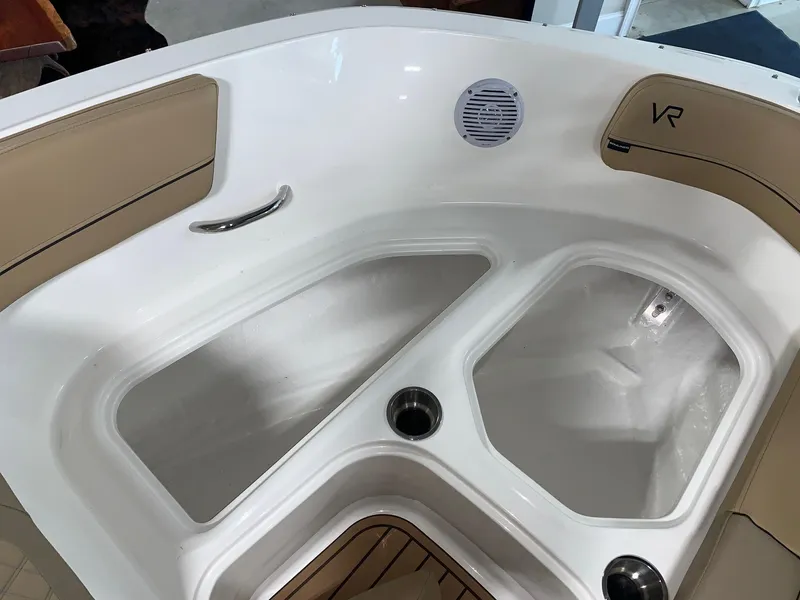 Slide: The Image of 2024 Bayliner VR5 boat interior with seating and storage compartments. - 11