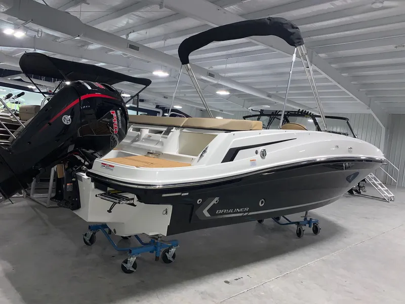 Slide: The Image of 2024 Bayliner VR5 boat with outboard motor in showroom. - 1